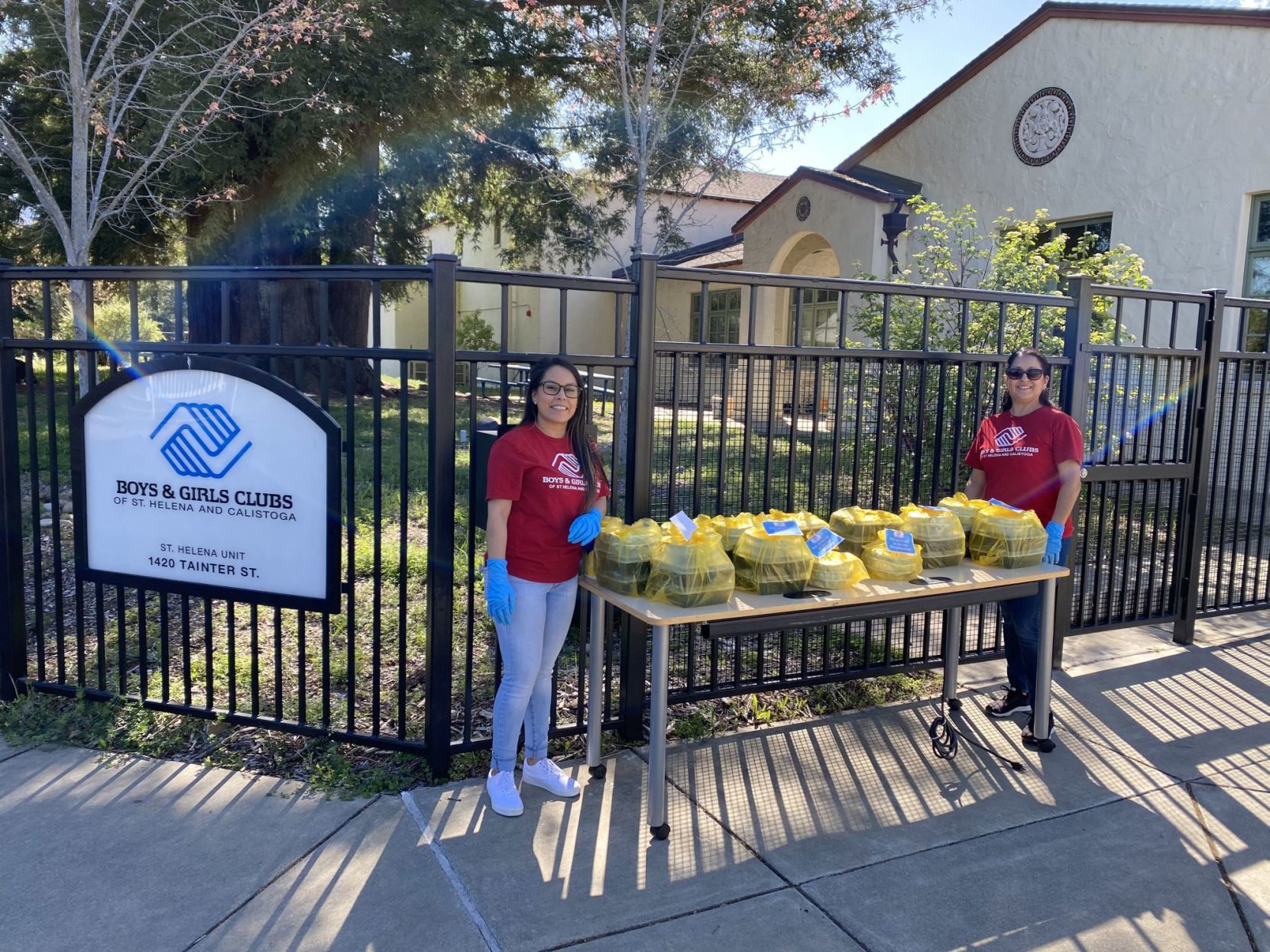 Mariana Martinez, Marisa Iano in front of Boys & Girls Club